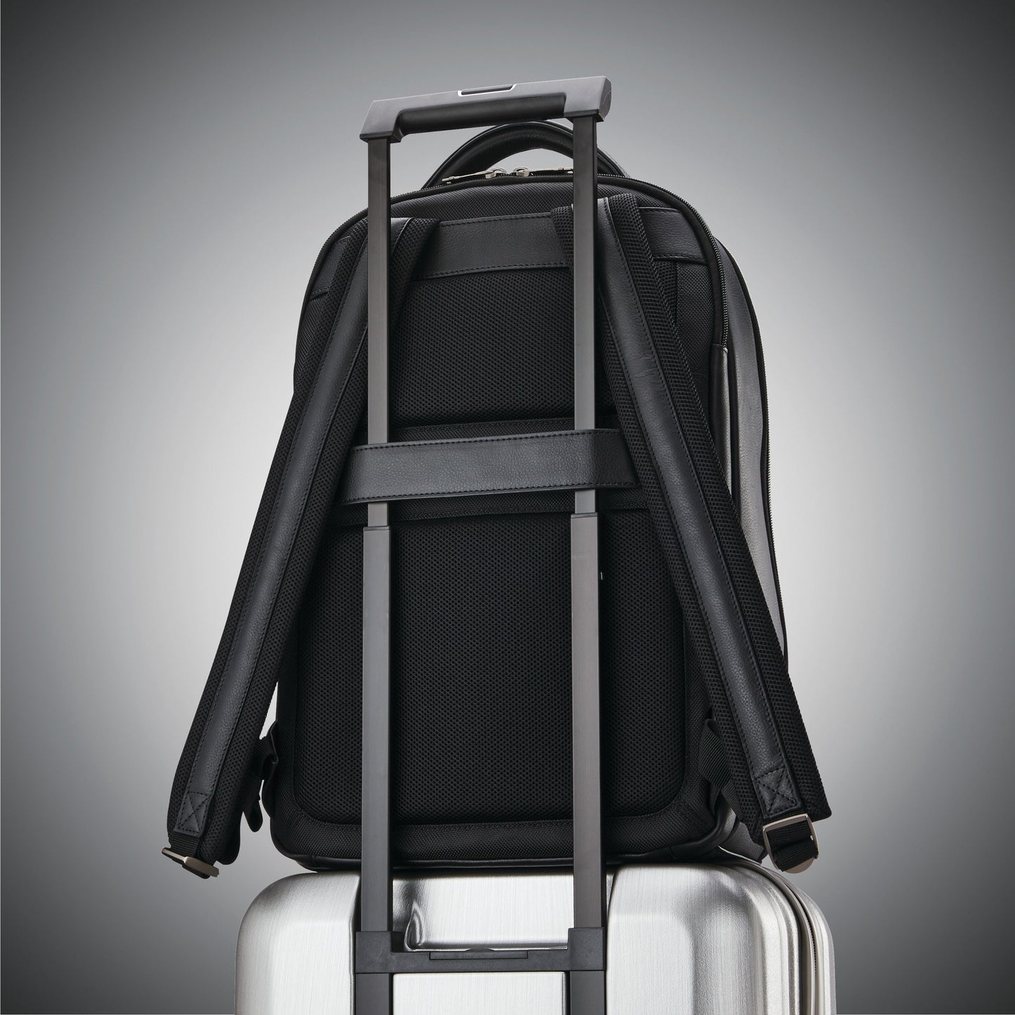 Leather backpack for business travel with separate laptop compartment