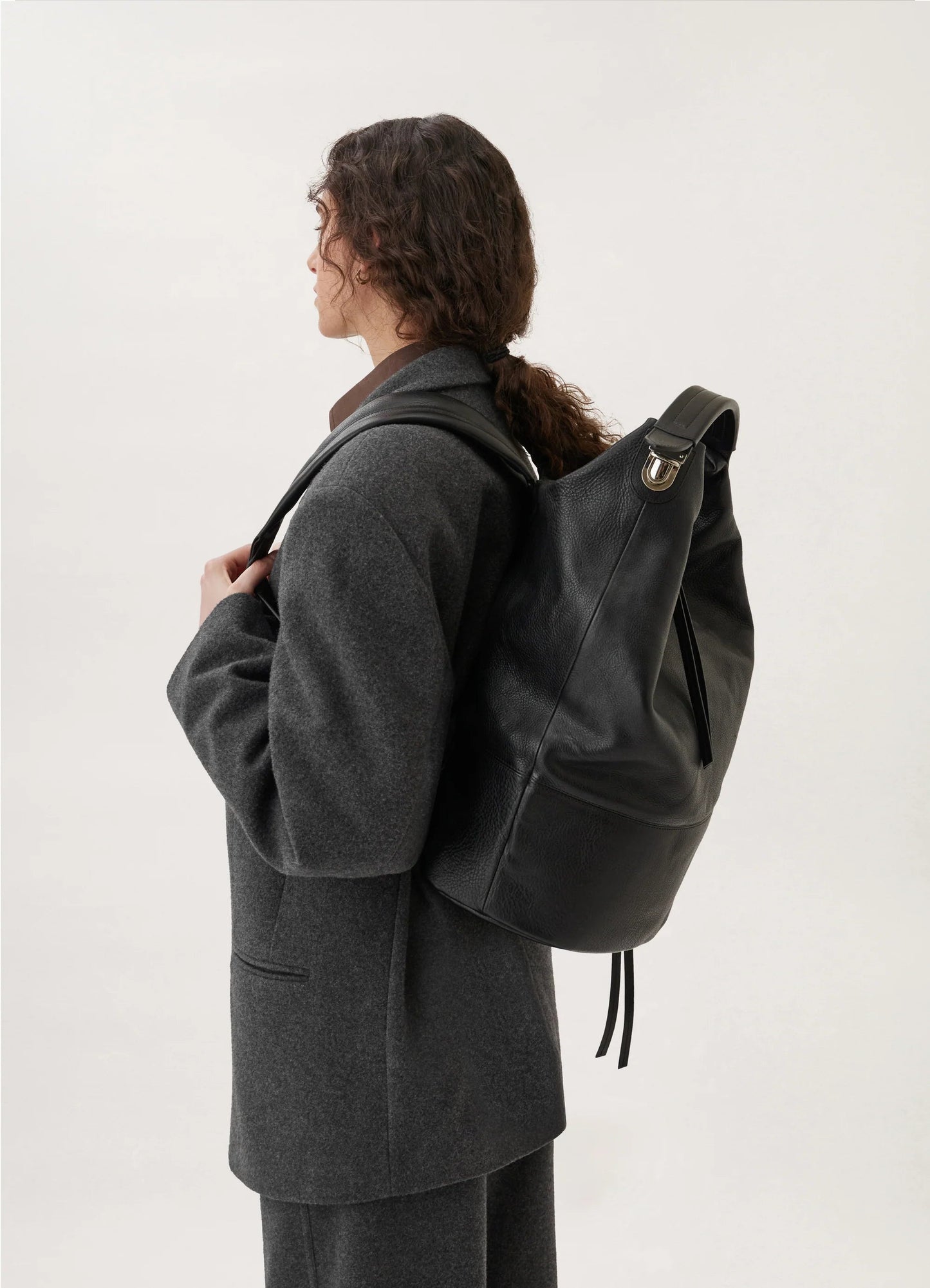 Convertible leather backpack bag that stands up