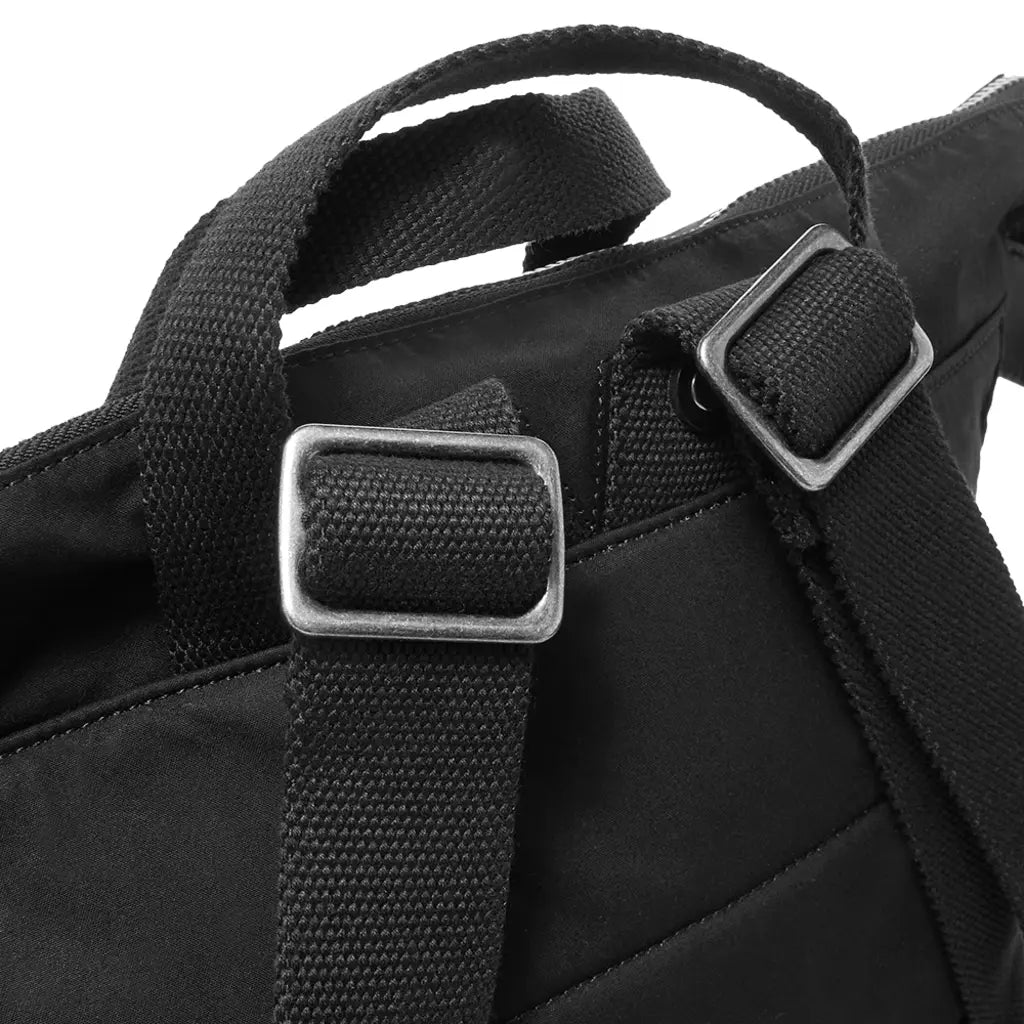 Waxed cotton tote backpack with leather trim